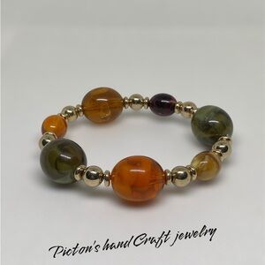 Dyelon's Handcrafted Orange and Green Beaded Bracelet